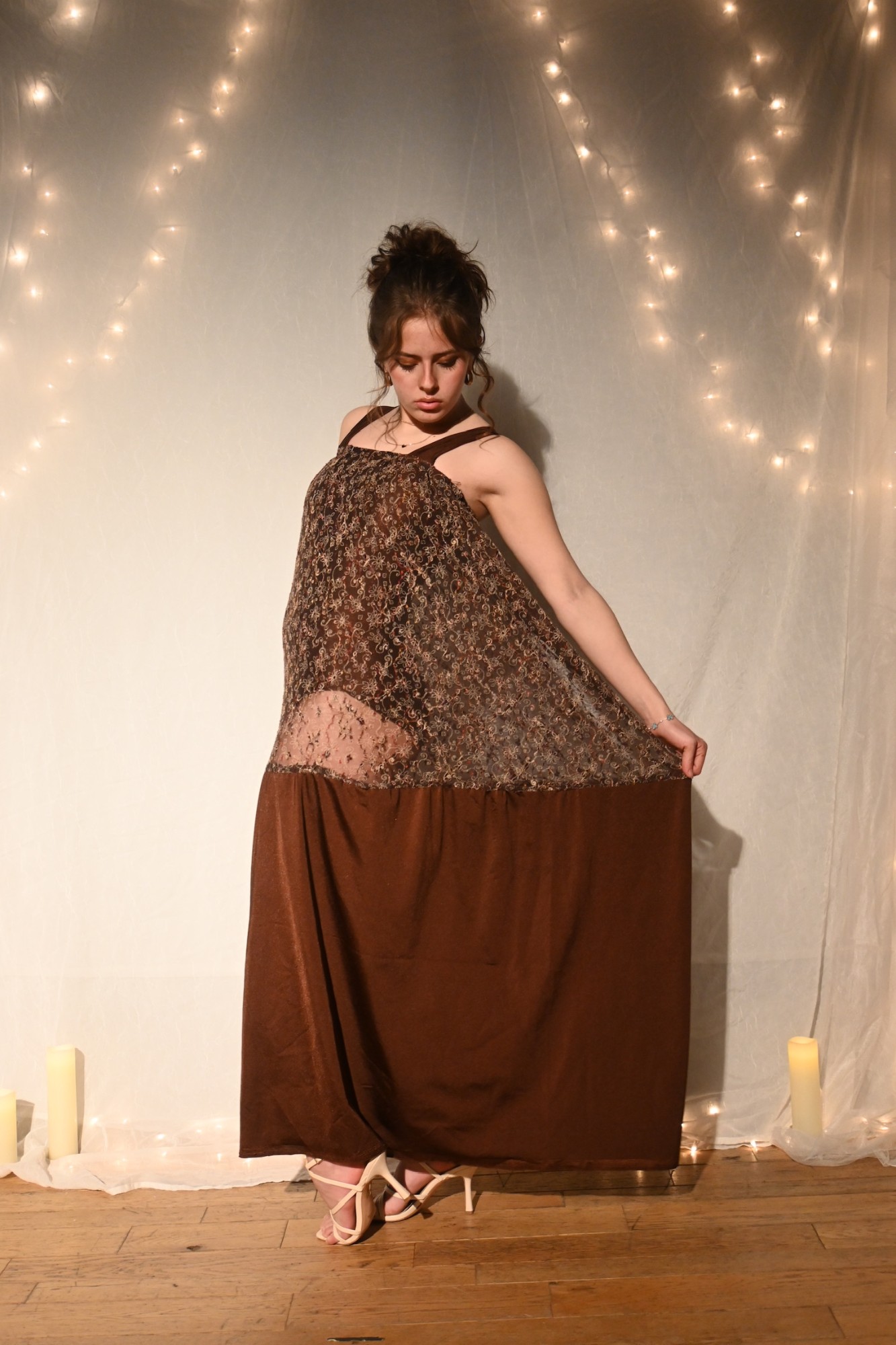 Model in a brown sheer lace overlay gown with a solid brown underskirt, ENNA runway show
