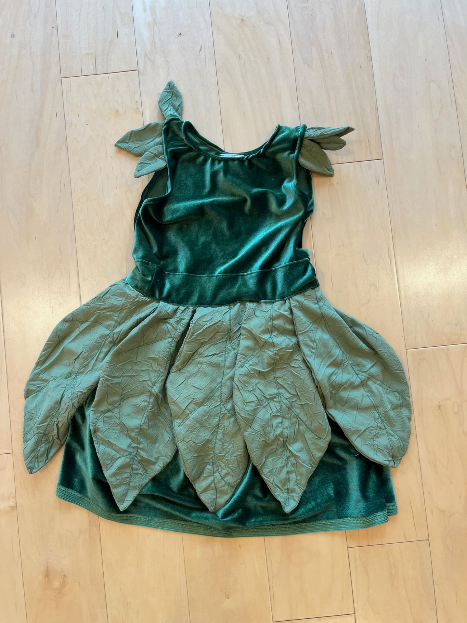 Green velvet and taffeta leaf-shaped fairy costume dress, laid flat